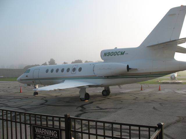 N900CM — - Falcon 50 N900CM parked on the main flight ramp at FBO York Aviation on a Hazy Morning