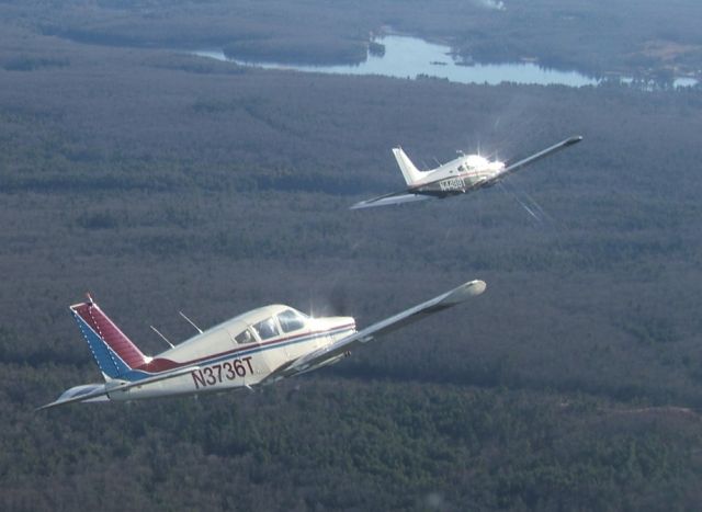 Piper Cherokee Arrow (N3736T) - Bernie Velivis (36T) and Jack Cunnif (98T) flying in loose formation near Nashua NH. Brian Carr took the picture while flying his Piper Dakota.