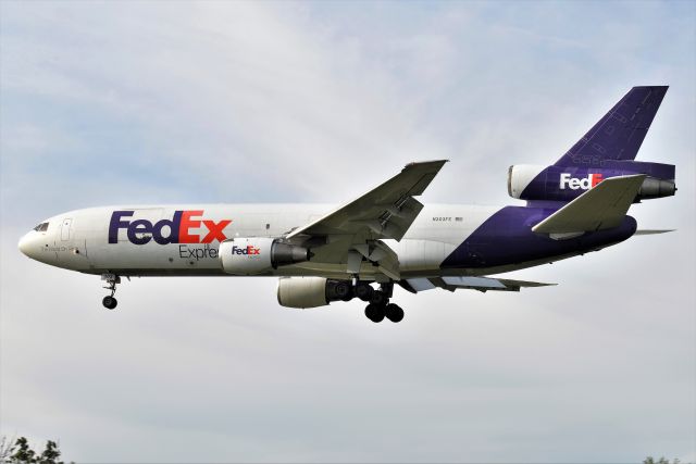 McDonnell Douglas DC-10 (N303FE) - Not the best pic, but the DC-10 numbers are really dwindling rapidly. Here is I believe the oldest DC/MD-10-30(F) operating in the world, N303FE. She was originally built for Trans International in 1973 as N103TV. Shown landing Runway 14 earlier this morning 09-30-21. Shoot them while you can. S/N 46802 LN:110