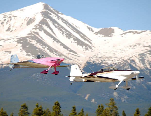 — — - A pair of Vans aircraft take off after performing a flyover for Memorial Day.  They were followed by a second formation of two.