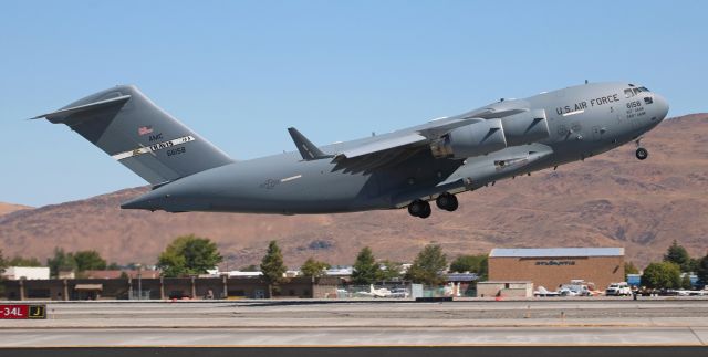 Boeing Globemaster III (06-6158) - A Travis-based Boeing C-17A Globemaster III (066158) is off runway 16R and on the climb after dropping off support personnel and equipment for the USAF Thunderbirds Demo Team. The team arrived less than ten minutes before this Globemaster departed.