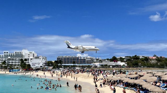 Canadair Challenger (C-GZUM) - C-GZUM, a Bombardier Challenger 650, gliding into SXM over Maho Beach. 3/21/22. 