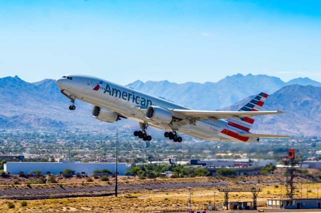 Boeing 777-200 (N784AN) - American Airlines 777-200 taking off from PHX on 10/9/22. Taken with a Canon 850D and Rokinon 135mm f/2 manual focus lens.