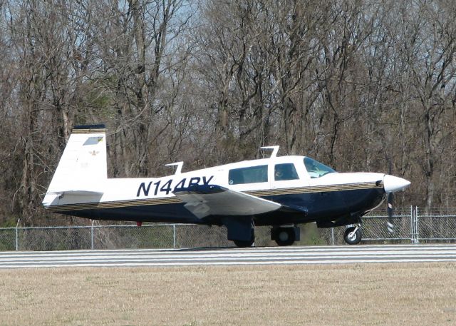 Mooney M-20 (N144BY) - On runway 14 at the Downtown Shreveport airport.