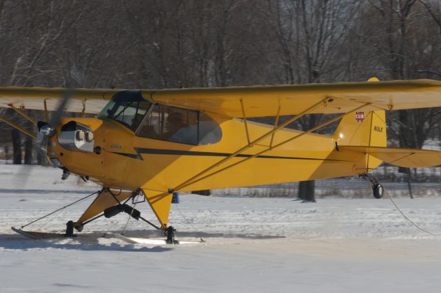 — — - Piper Cub Landing at EAA Ski Plane Fly-In Sat January 21, 2012