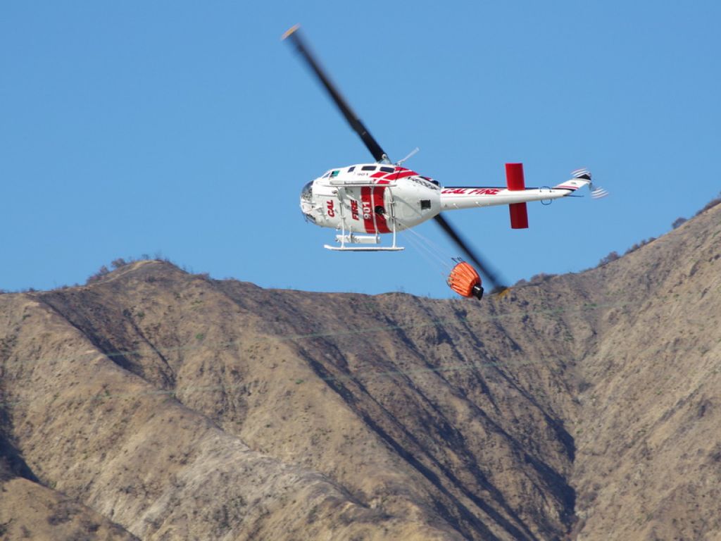 Bell UH-1V Iroquois (N901) - Cal Fire Huey 90 deg roll after water drop returning to reservoir in Glendora Ca. 1/16/14