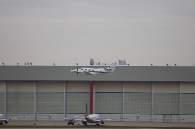 N405SA — - A rare Fairchild-Swearingen Merlin makes a VERY shallow climb out of Indy