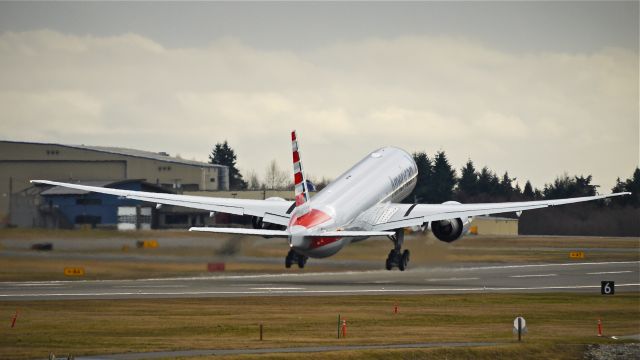 BOEING 777-300 (N727AN) - BOE311 on rotation from Rwy 16R to begin a flight test on 2/19/14. (LN:1176 cn 33541).