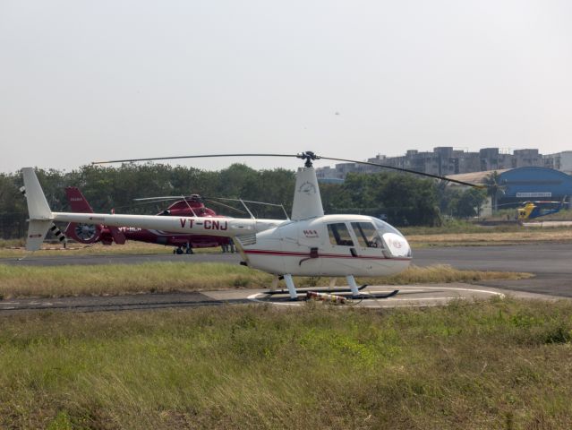 Robinson R-44 (VT-CNJ) - 25 MAR 2018 in India. Busy heliport serving the offshore oil industry.