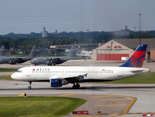 Airbus A320 (N320US) - Landing 30R at MSP on 07/31/2011