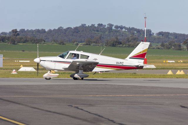 Piper Cherokee (VH-PYZ) - Piper PA-28-235 Cherokee (VH-PYZ) taxiing at Wagga Wagga Airport.