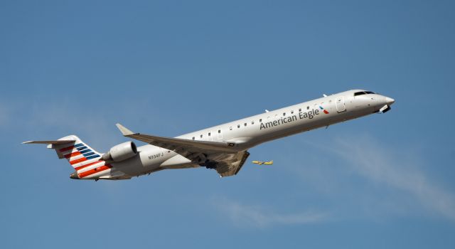 Canadair Regional Jet CRJ-900 (N934FJ) - American CRJ9 departing KPHX with Spirit flight in background