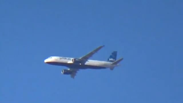 Airbus A320 (N554JB) - Caught while watching a football practice.