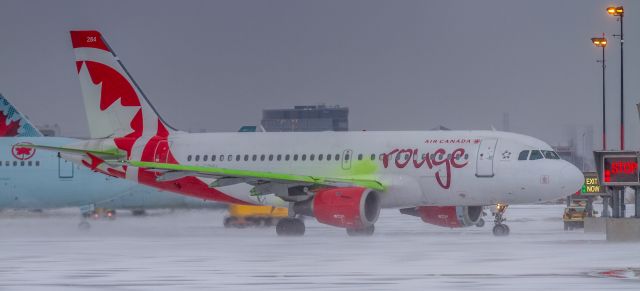Airbus A319 (C-GBIN) - New Years Day spotting at YYZ. C-GBIN heads out of the de-icing bay and off to runway 24R for take off