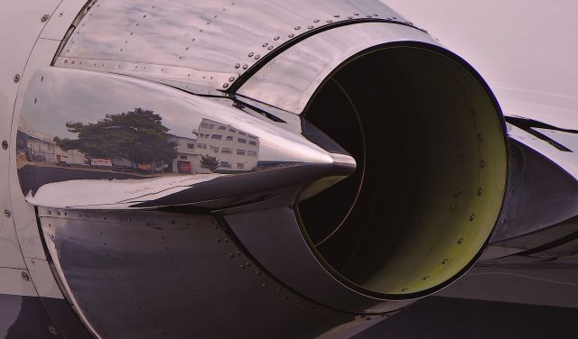 Cessna Citation II (N827DP) - Reflection from N827DP thrust reverser at Cape May County NJ airport terminal.