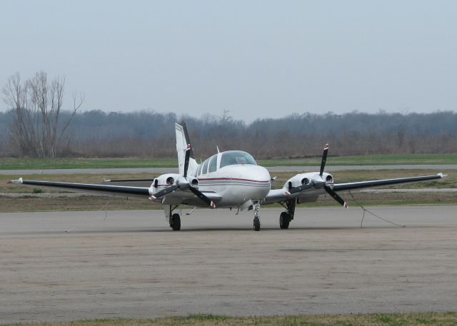 Beechcraft Baron (58) (N2046A) - Parked at the Tallulah,LA/Vicksburg,MS airport.