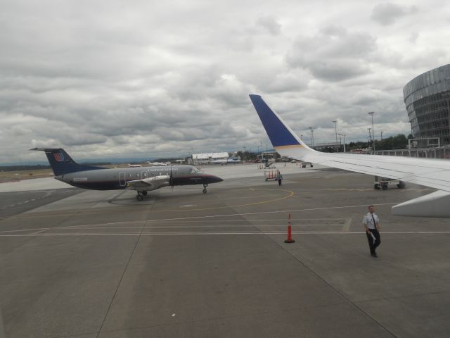 Embraer EMB-120 Brasilia (N223SW) - Departing from KPDX on a cloudy day.