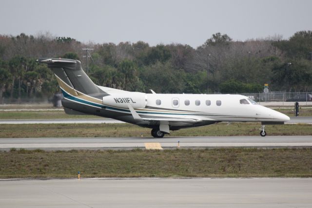 Embraer Phenom 300 (N311FL) - Options Flight 311 (N311FL) taxis for departure at Sarasota-Bradenton International Airport