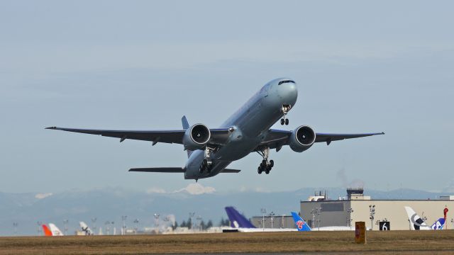 BOEING 777-300 (C-FNNU) - ACA7054 climbs from Rwy 16R to begin its delivery flight to KVCV on 12/19/13. (LN:1161 cn 43249).