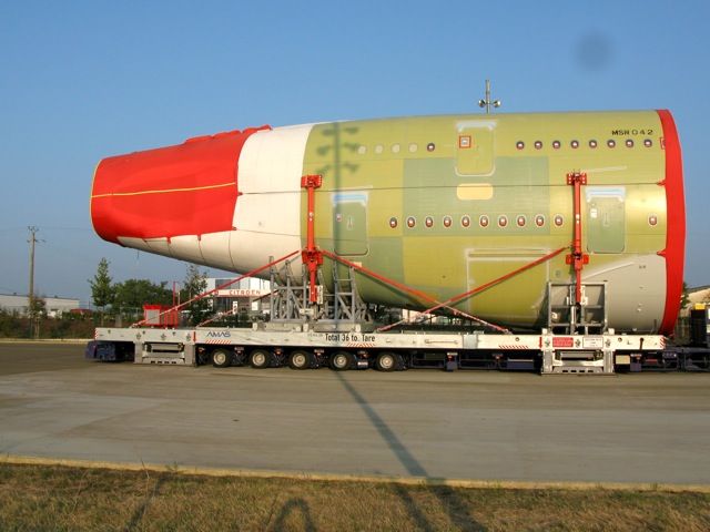 Airbus A380-800 — - Airbus A380 parts being trailered to Toulouse for assembly. They arrive on the French coast from England and Germany and are moved to Toulouse by night (about 40KM) per day.