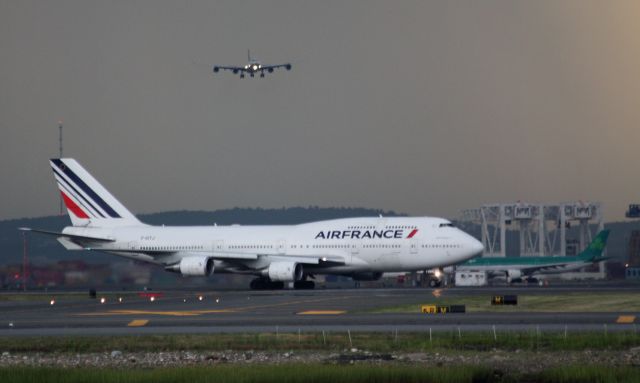 Boeing 747-400 (F-GITJ) - International activity at Logan with heavy rain storm in back. 