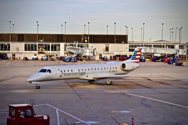 N661JA — - An Enjoy ERJ-145 taxis into the gate at O'hares terminal 3