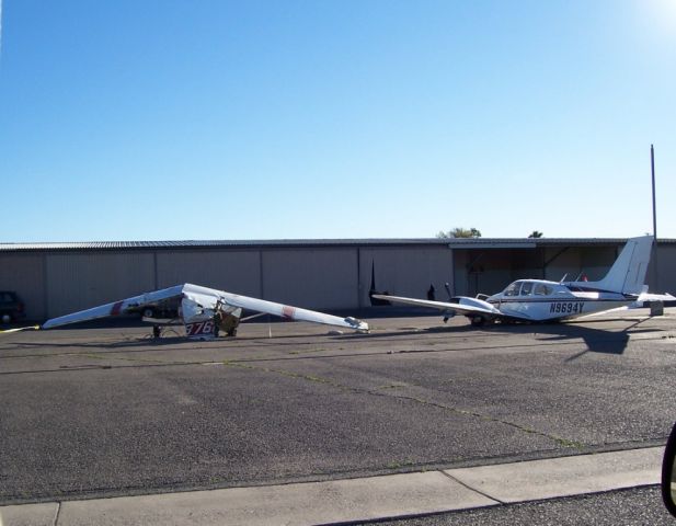Beechcraft Baron (58) (N9694Y) - "The pilot stated that he had amassed a total flight time in multiengine airplanes of 45 hours, and that he did not possess a multiengine rating."    Report:  Aircraft on takeoff, pilot reported that the right-hand engine failed, veered off the runway, struck 2 parked aircraft and a hangar, Corona, CA  The NTSB investigation has revealed that the pilot does not possess a rating for multi-engine aircraft.  Witnesses say the engines sounded normal.  The wind was gusting up to 90 degrees across the runway at the time of the accident.