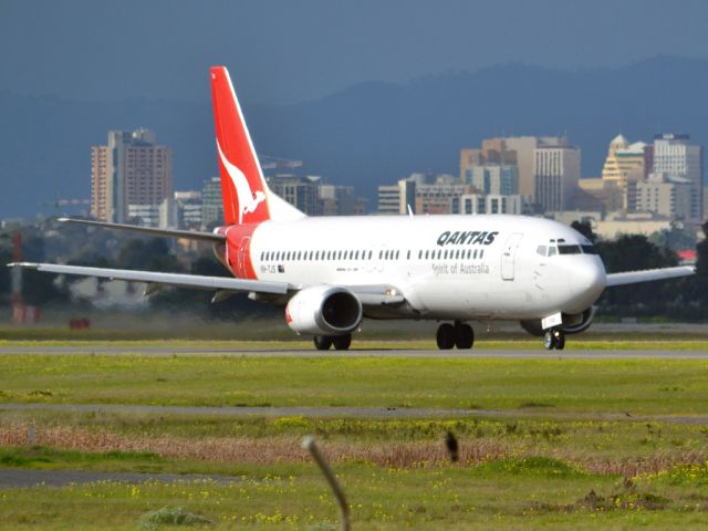 BOEING 737-400 (VH-TJS) - On taxi-way heading for take off on runway 05. Thursday 12th July 2012.