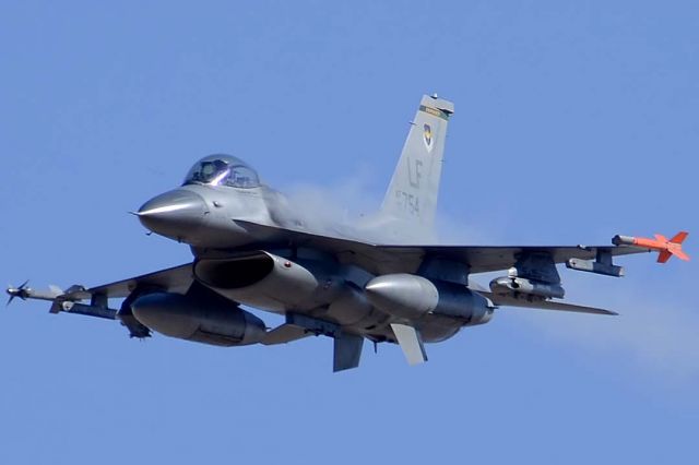 Lockheed F-16 Fighting Falcon (90-0754) - F-16C Block 42J Fighting Falcon 90-0752 of the 310th Fighter Squadron Top Hats based at Luke Air Force Base fires its M61 A1 Vulcan gatling cannon at a target on the Goldwater Bombing Range. .