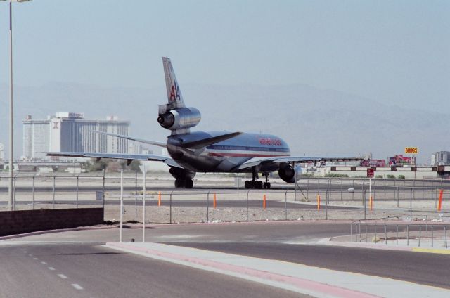 N115AA — - KLAS - Aug 1989 looking NNW from near the old terminal - very high winds this day using runway 10 departures.