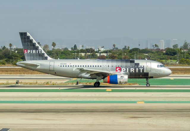 Airbus A319 (N512NK) - "The Spirit of Turks and Caicos Islands" makes her way to runway 24L at LAX as NKS504 to New Orleans with some borrowed engine cowl.