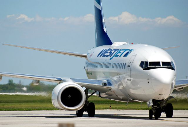 BOEING 737-600 (C-GBWS) - WestJet Boeing 737-600 pulling into YQG from YYC.