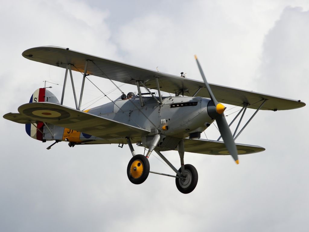 — — - A vintage Hawker Hind performs a flypast at Flying Legends 2012.