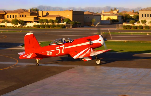 VOUGHT-SIKORSKY V-166 Corsair (N5588N) - Race 57 taxis out for a morning flight. BTW, those are houses with attached hangars in the background.