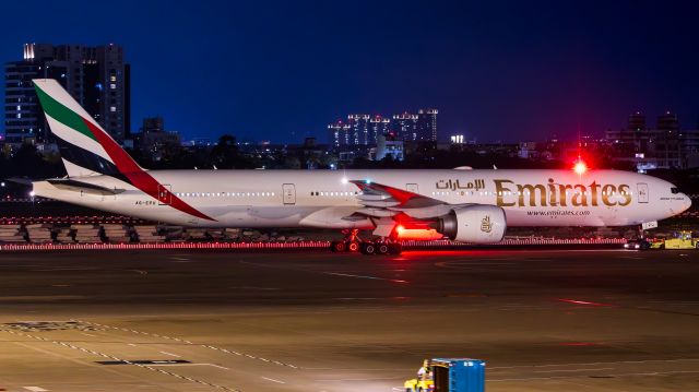 BOEING 777-300ER (A6-EPU) - The flight was diverted to Kaohsiung International airport due to bad weather.br /This picture shows that the Emirates was being moved from Gate 23 to another apron for rest.
