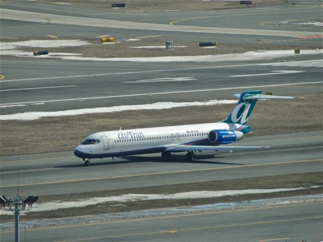 Boeing 717-200 — - airTran 717-200 taxiing to a gate for parking after arriving on 22L at KBOS.