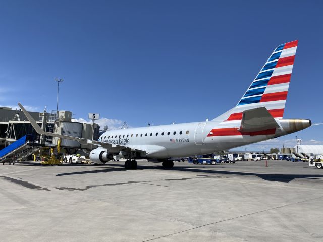 Embraer 175 (N285NN) - Almost ready to pushback, captain side wing walker. 