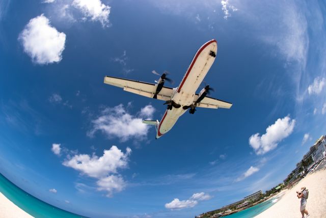 — — - Landing over Maho Beach