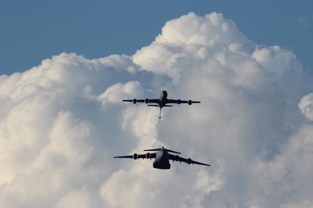 Boeing C-135B Stratolifter (AFR600381) - Air Refueling Demo amidst the towering cumulus clouds at Oshkosh AirVenture 2023. Courtesy of 97th Air Mobility Command from Altus AFB OK. KC-135 refueling of C-17 Globemaster 3