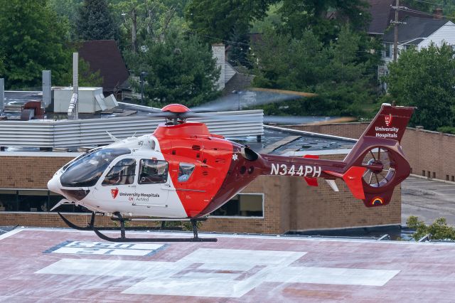 Eurocopter EC-635 (N344PH) - a few shots of an Airbus EC-135 P2+, University Hospitals AirMed 2 departing from Cleveland Clinic Fairview Hospital in the Westpark neighborhood of Cleveland, OH, Sunday afternoon, 13 Jul 2025. 