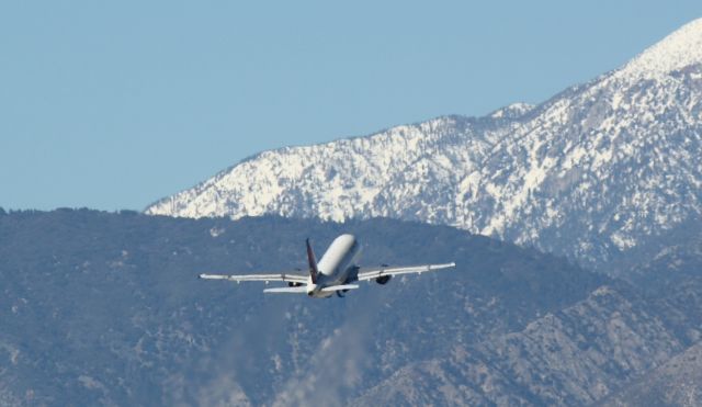 Airbus A319 (N340NB) - Wheels coming up off of 31L on 01/22/2011