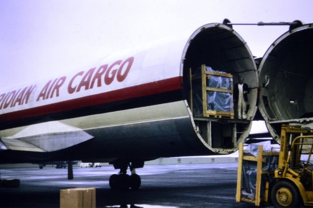 Canadair CL-44 Forty Four (N447T) - Trans Meridian Air Cargo - CL-44 (reg N447T - to the best of my knowedge). Rear loading at NCL circa 1973/74. Wonderful aircraft.