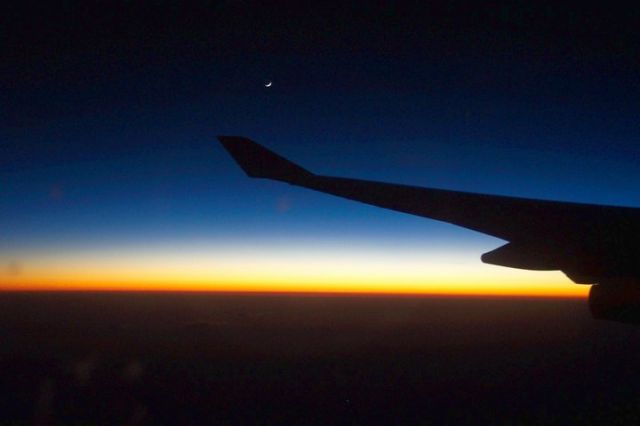 — — - Waxing moon over Atlantic on flight from Frankfurt to Buenos Aires.