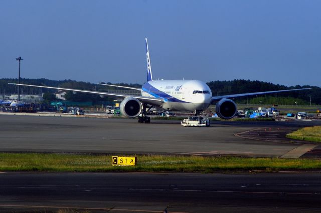 BOEING 777-300 (JA780A) - Being towed to Gate