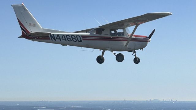 Cessna 152 (N4468Q) - Photographed NW of Atlanta with the city skyline and Stone Mountain in the background