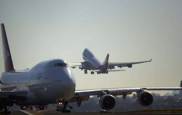 Boeing 747-200 — - Aussie pride. Two Qantas 747s at Sydney taking off from runway 34Lbr /br /Sorry dont know the rego.