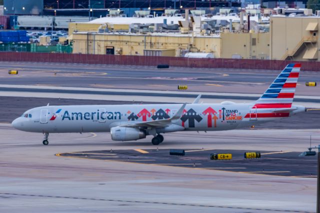 Airbus A321 (N162AA) - An American Airlines A321 in Stand Up to Cancer special livery taxiing at PHX on 2/13/23, the busiest day in PHX history, during the Super Bowl rush. Taken with a Canon R7 and Canon EF 100-400 II L lens.