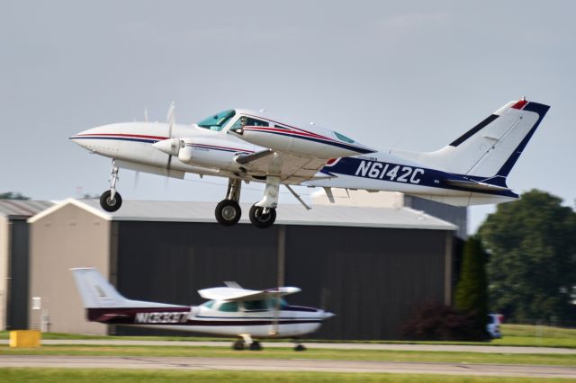 Cessna 310 (N6142C) - Departing Runway 26