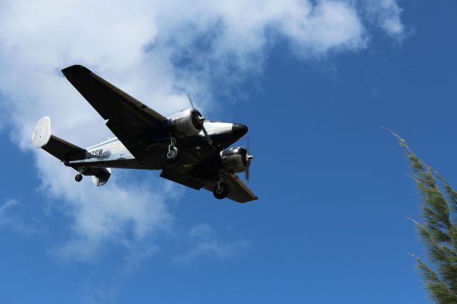 Beechcraft 18 (N737SW) - The Atlas Air Beechcraft 18 making a smooth landing on runway 14R ( I believe) 