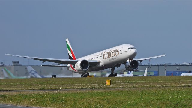 BOEING 777-300 (A6-EGU) - UAE777 on rotation from runway 16R beginning the delivery flight to OMDB / DXB on 7/13/12. The aircraft is a B777-31H(ER) LN:1028.